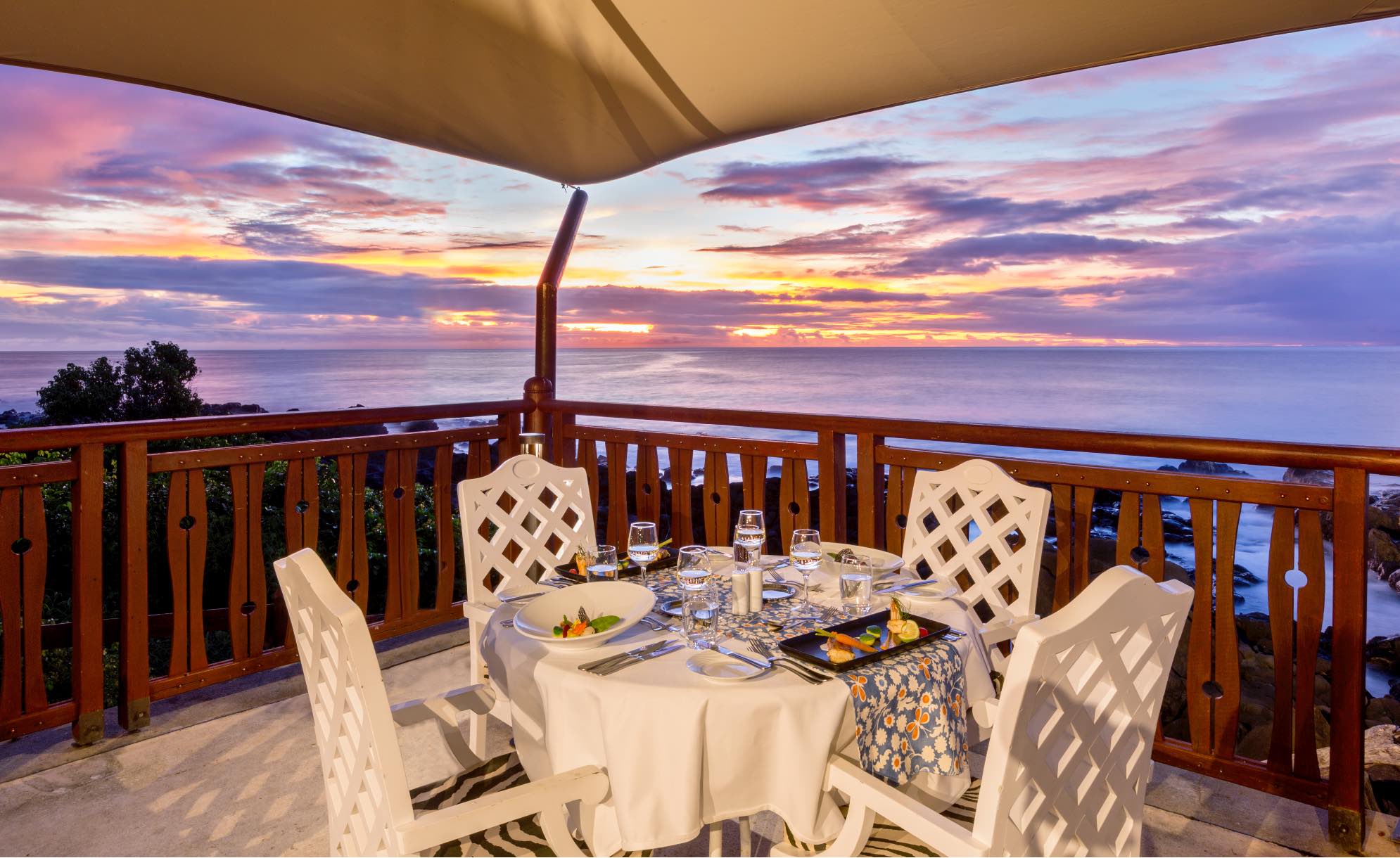 a dining table set on the terrace of a villa