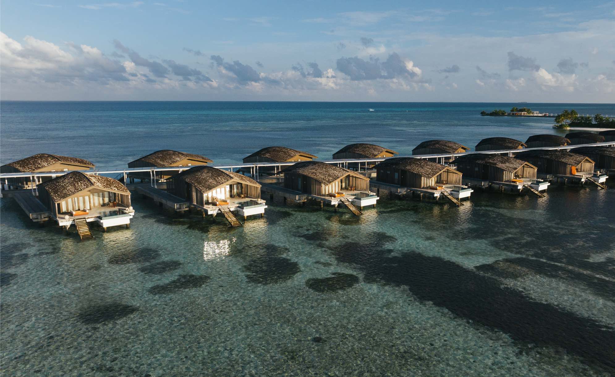 a row of villas at Club Med Finolhu Villas