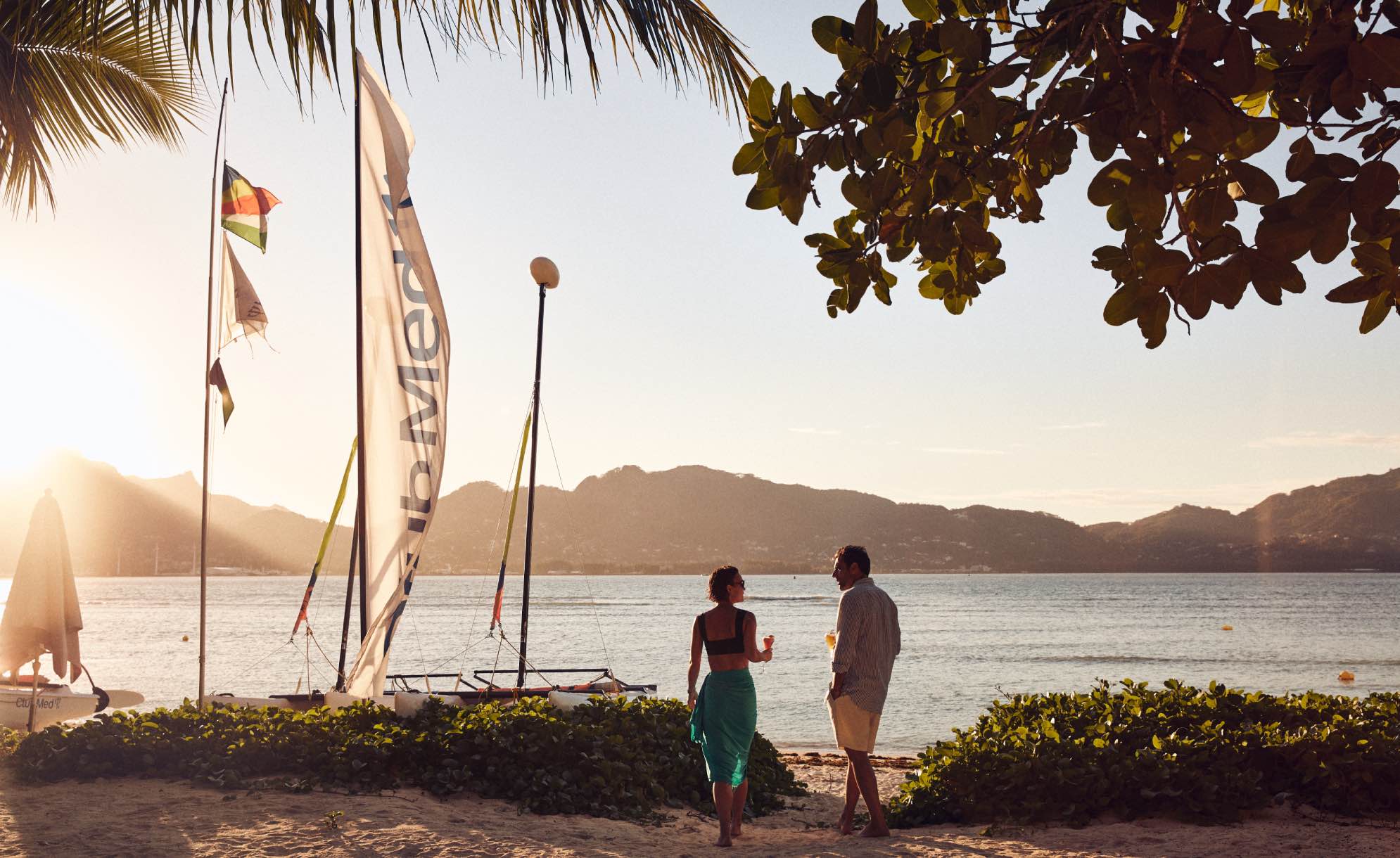 a man and a woman on the beach in Seychelles