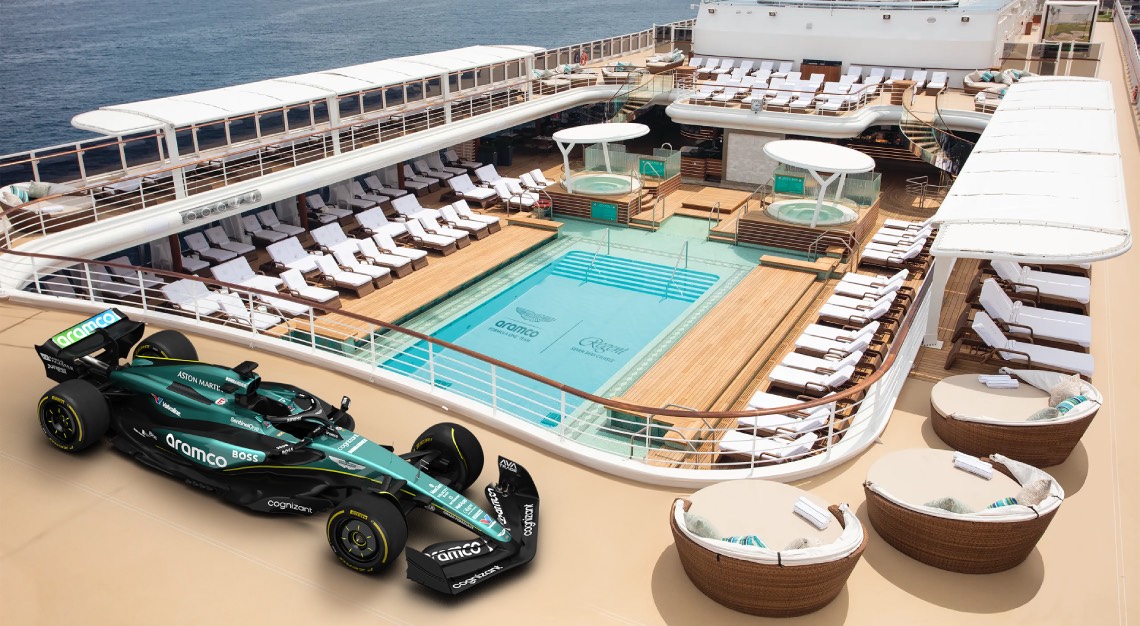 the deck of a cruise ship with an Aston Martin Aramco vehicle on board