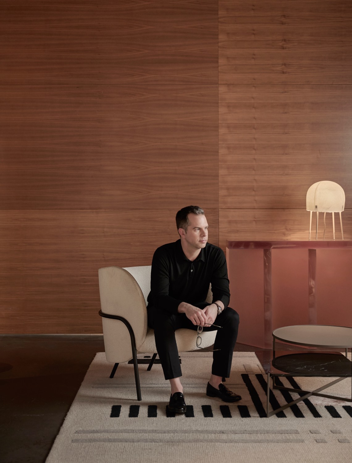 Leighton Clarke sitting in a Space Furniture showroom