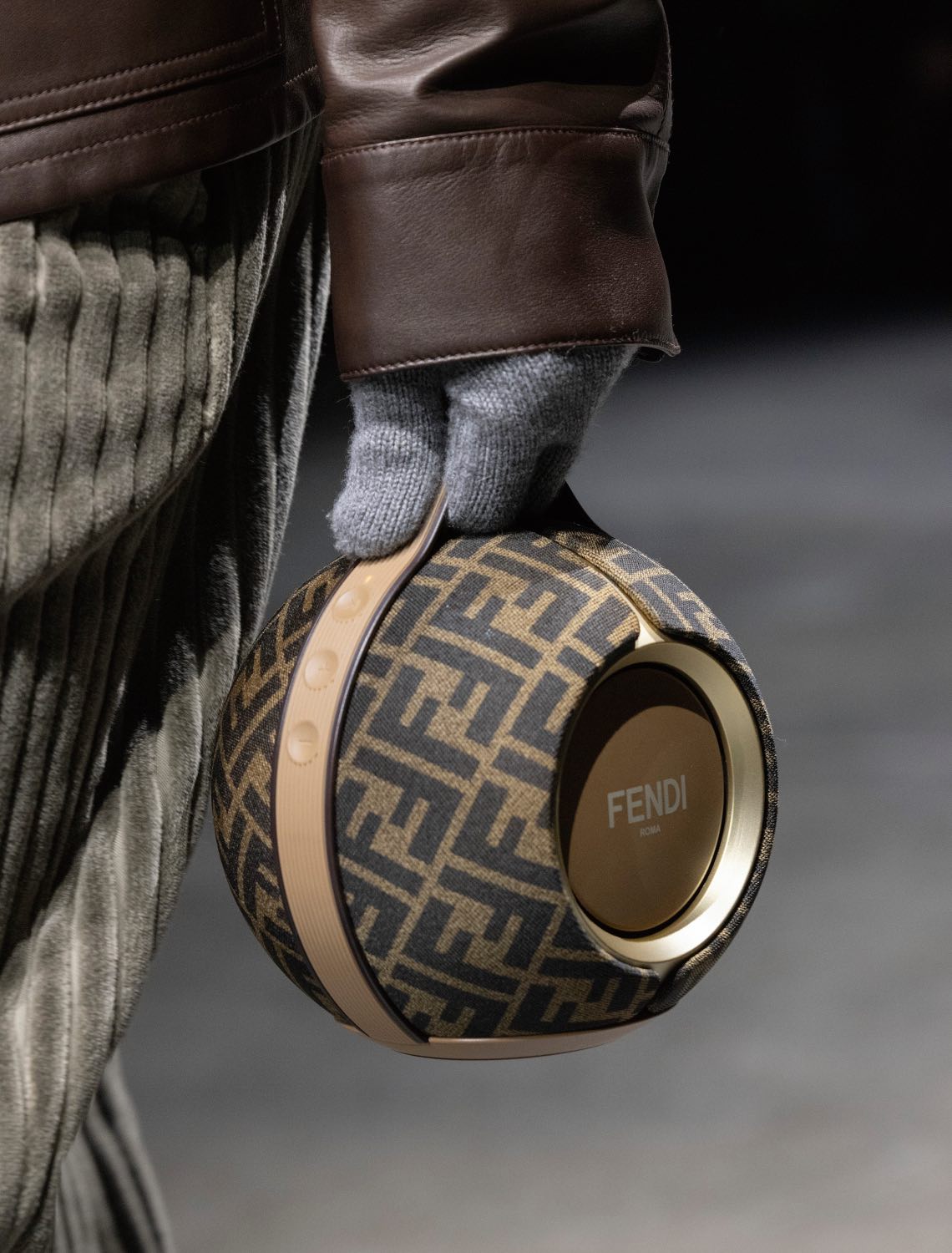 a model carrying the Fendi x devialet speaker at the Milan runway show this year