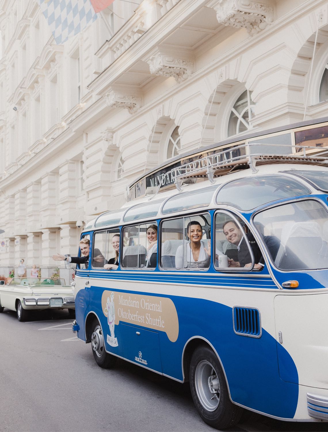 a vintage Bavarian bus bringing guests to Oktoberfest