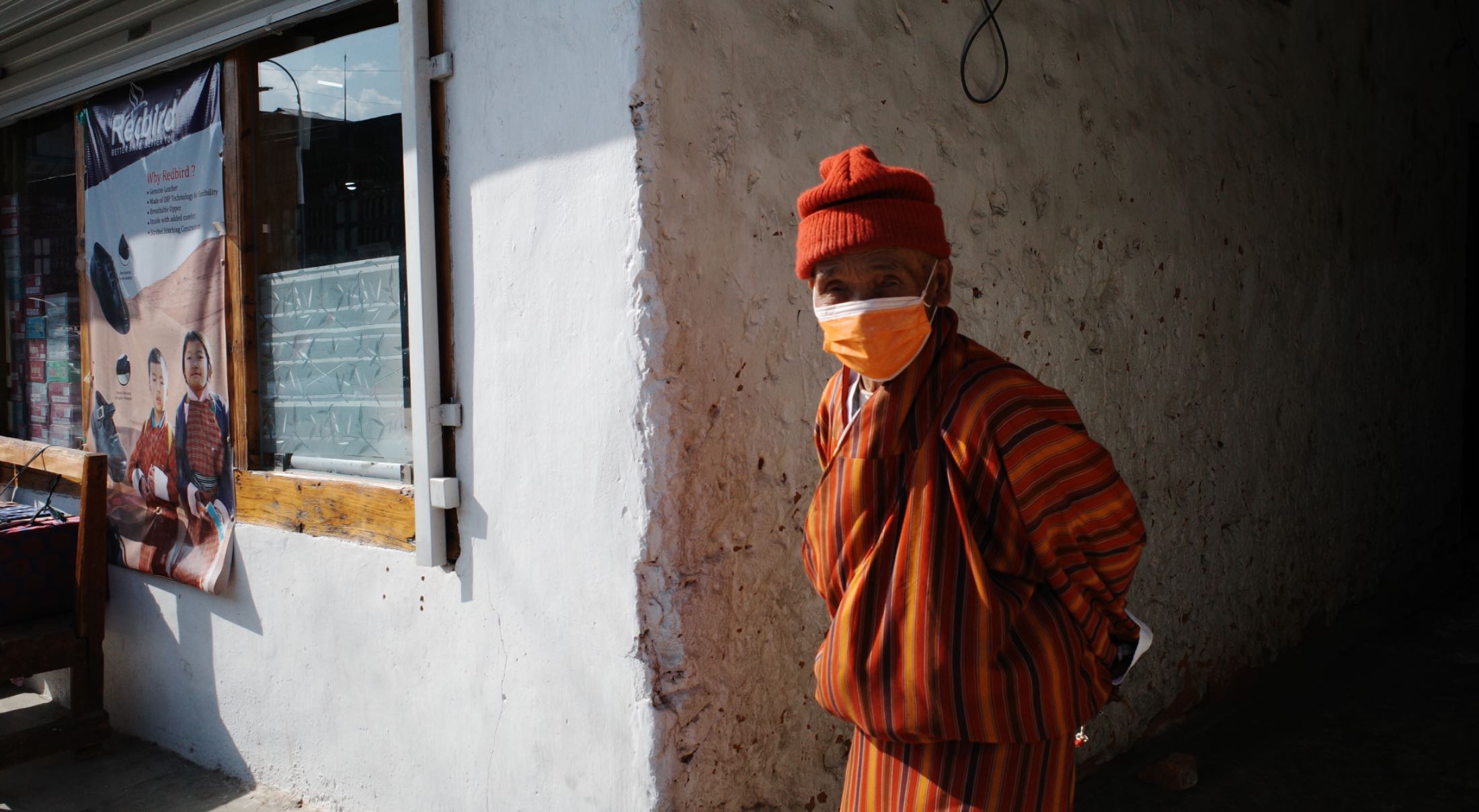 a man dressed in Bhutanese traditional garb in Bhutan