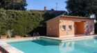 The grounds include a large swimming pool and a cabana with changing rooms.
