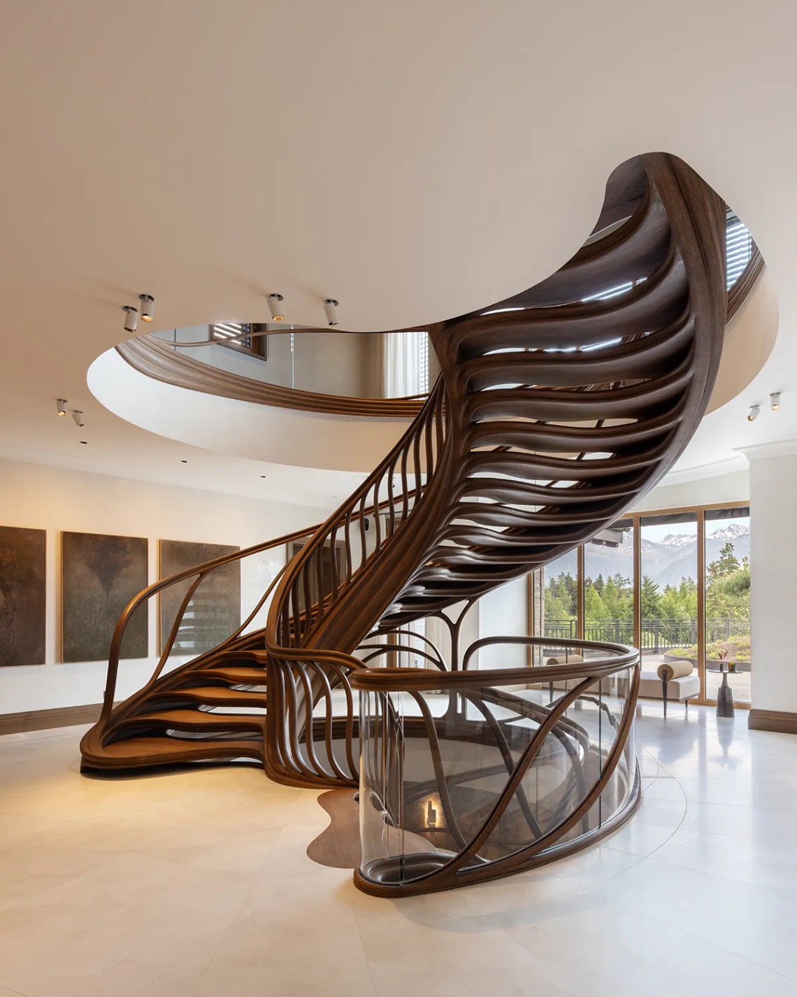 Inside a Swiss chalet centred around a huge, sculptural staircase